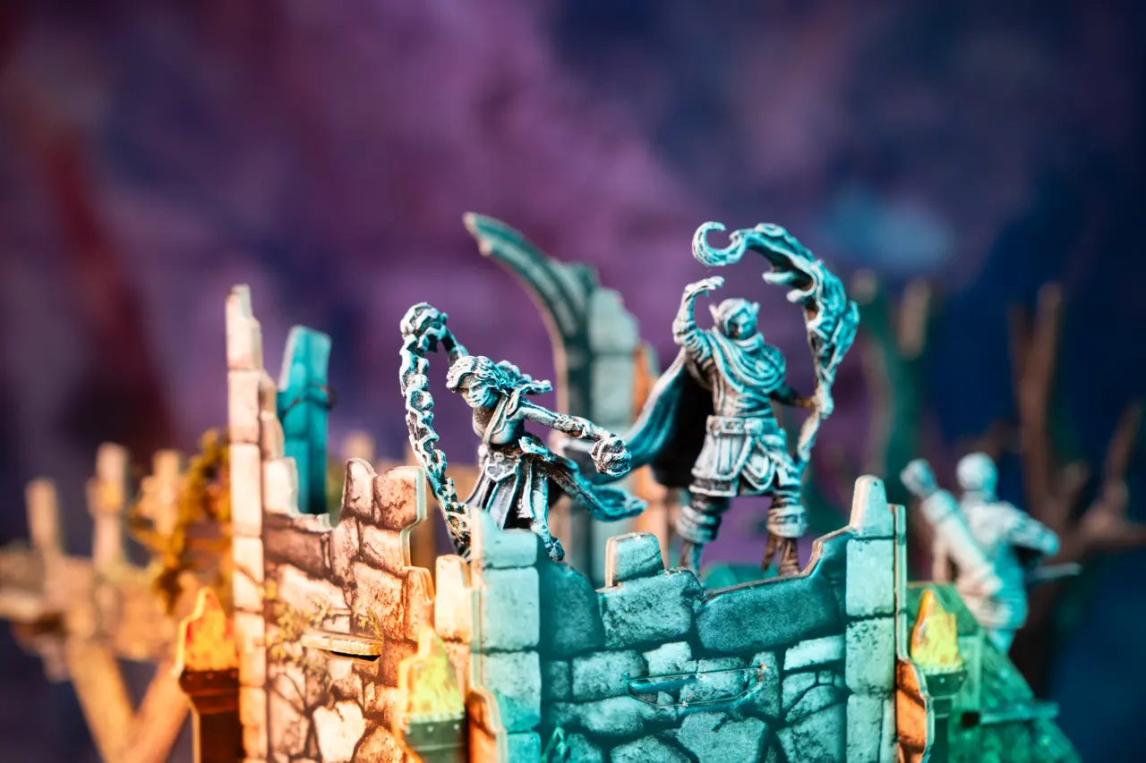 Magic users casting spells on top of ruins